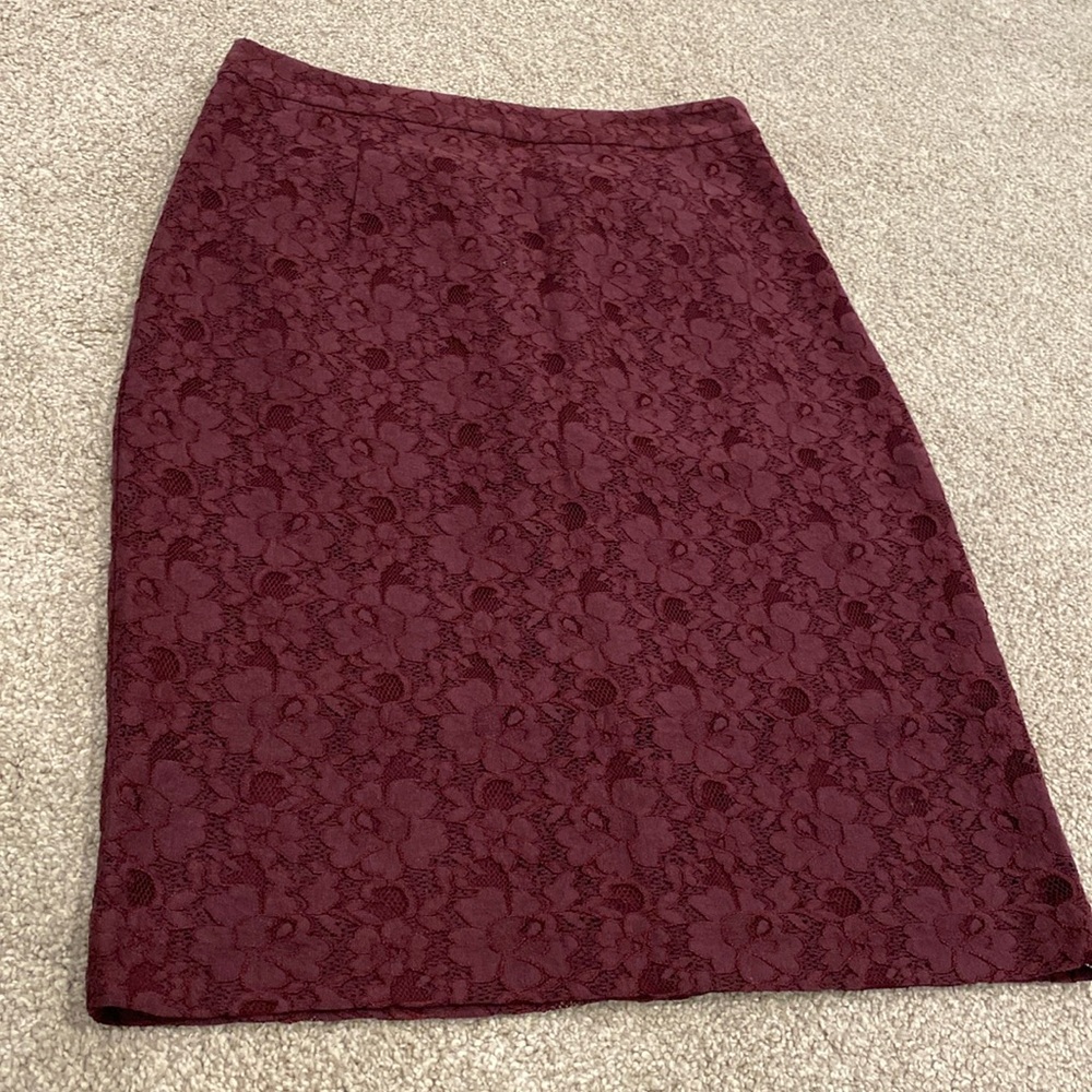 Maroon lace floral skirt.
